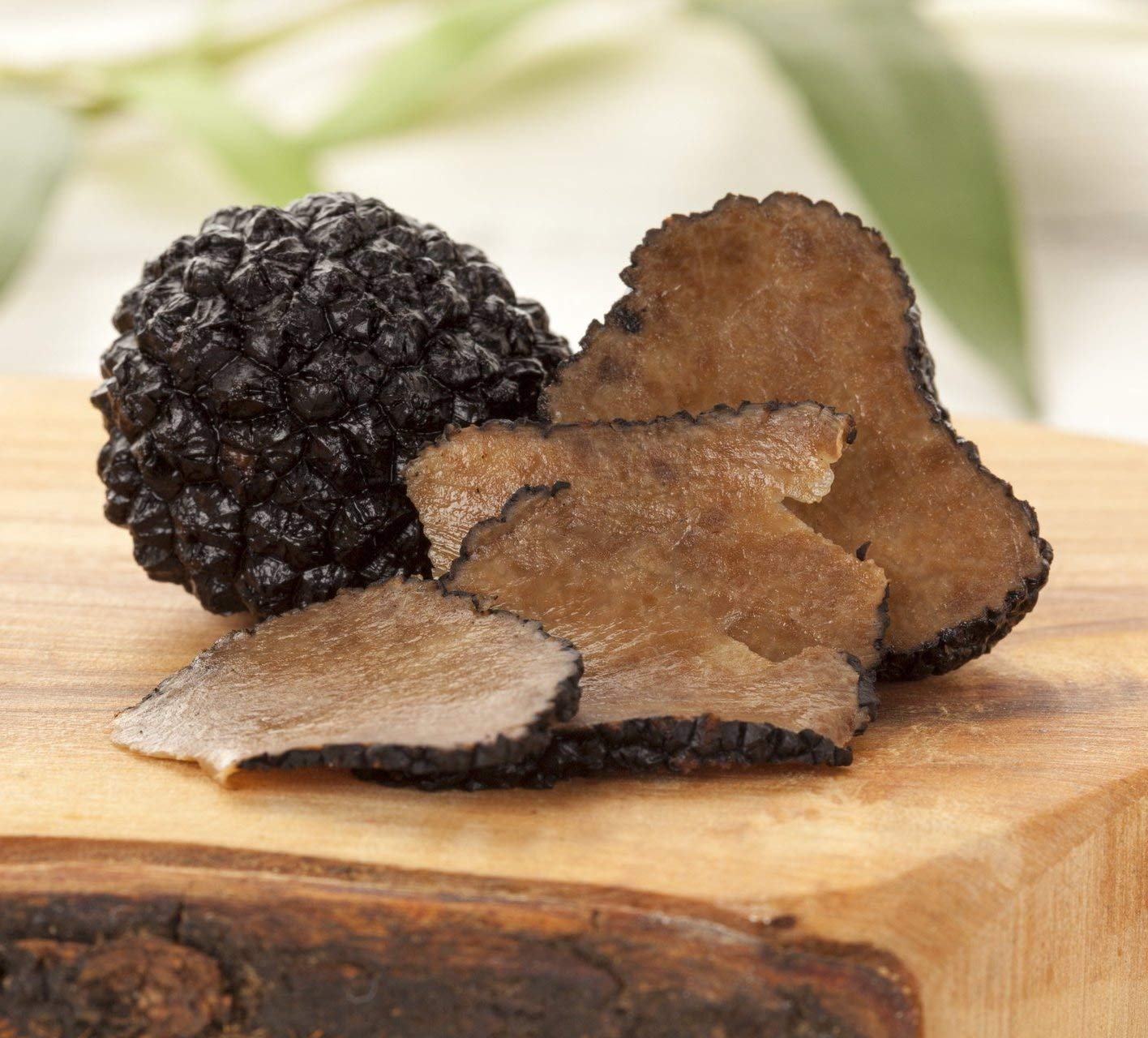 Truffles on a wooden surface with a blurred natural background