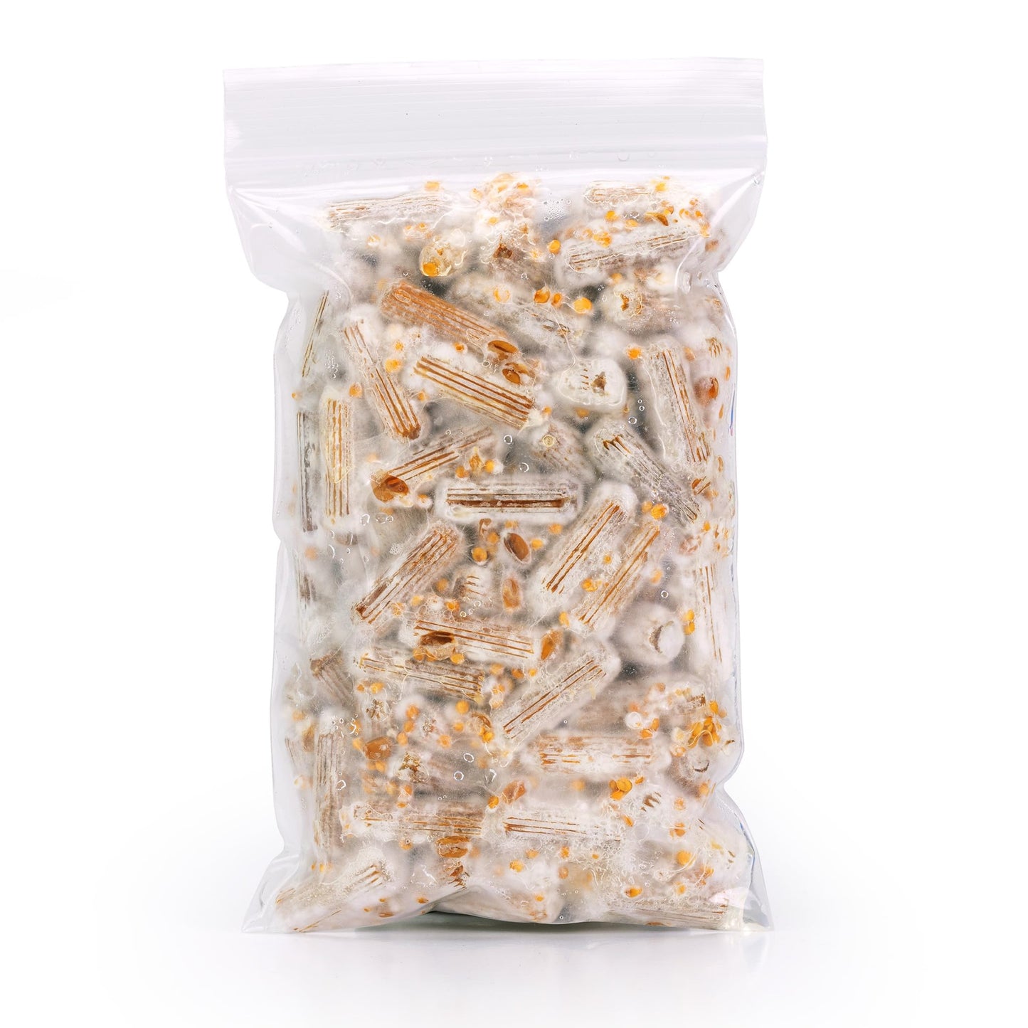 Clear plastic packaging filled with mushroom plugs on a white background
